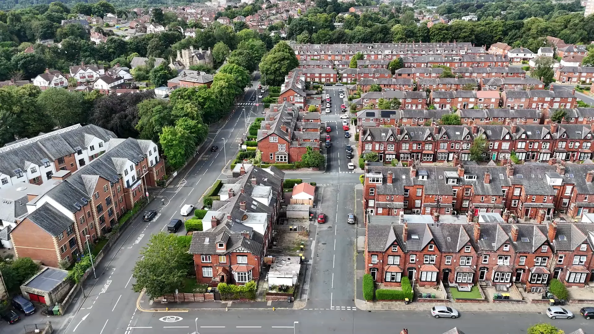 Rows of terraced houses and slate roofs seen from above