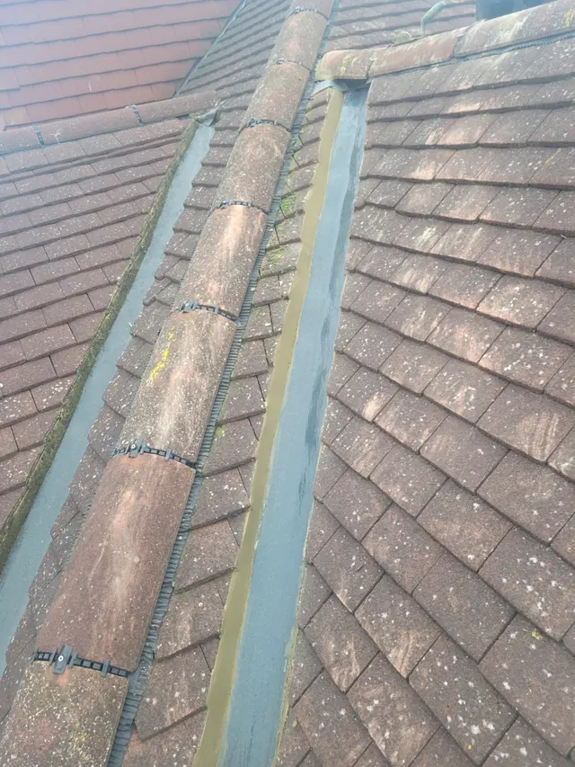 A new lead valley between two tiled roof slopes