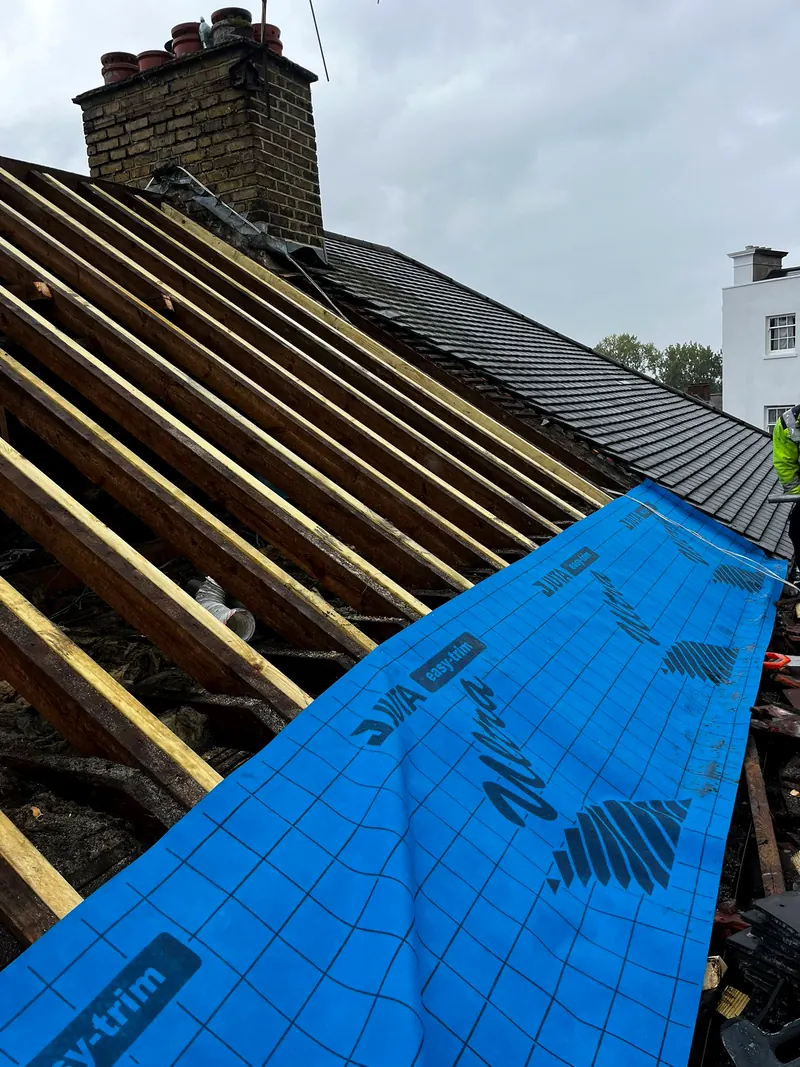 A full strip and re-roof in slate or tile, with new membrane and battens underneath.